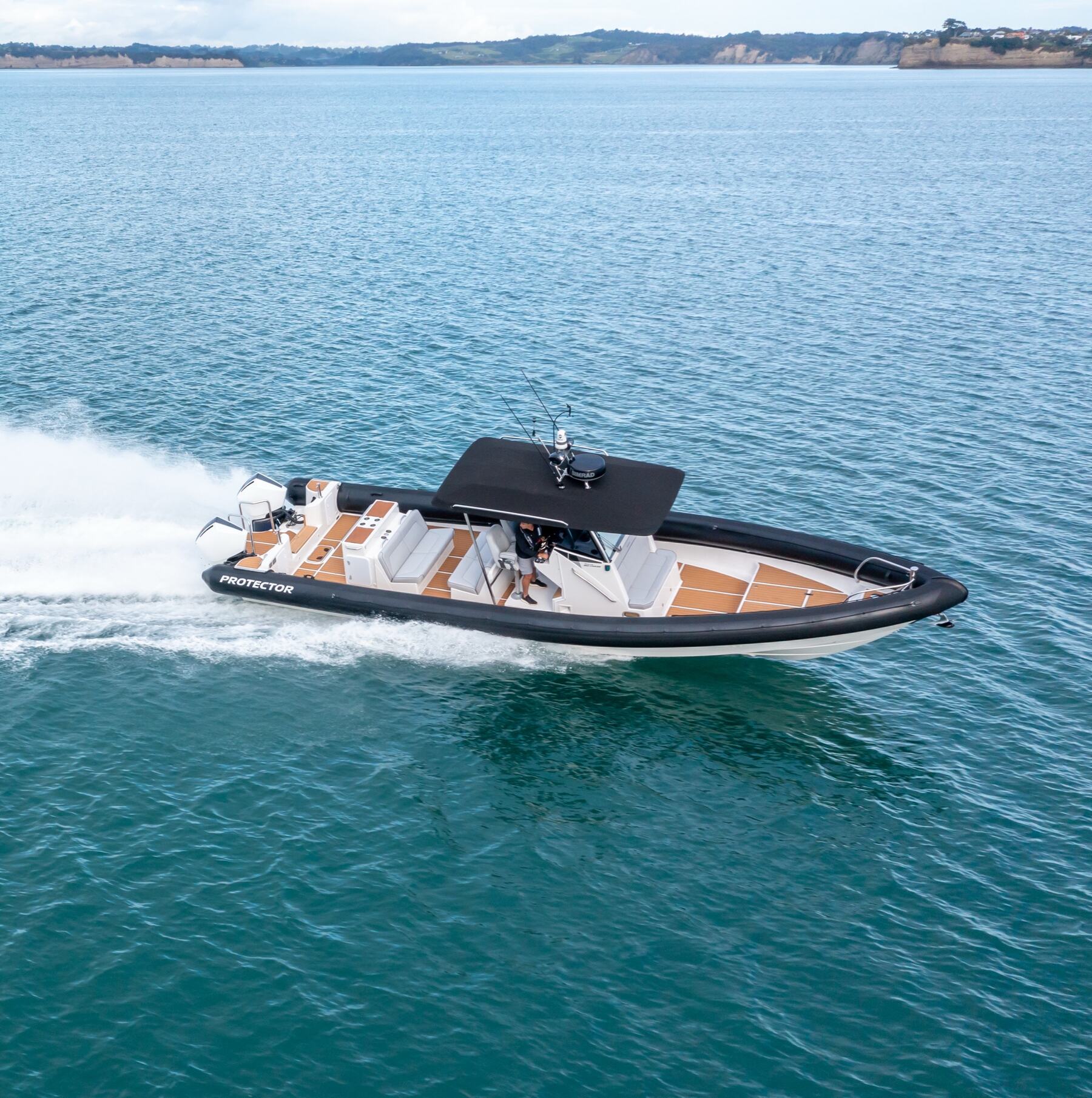 Protector 410 Chase running at speed, deep-vee hull cutting through open water