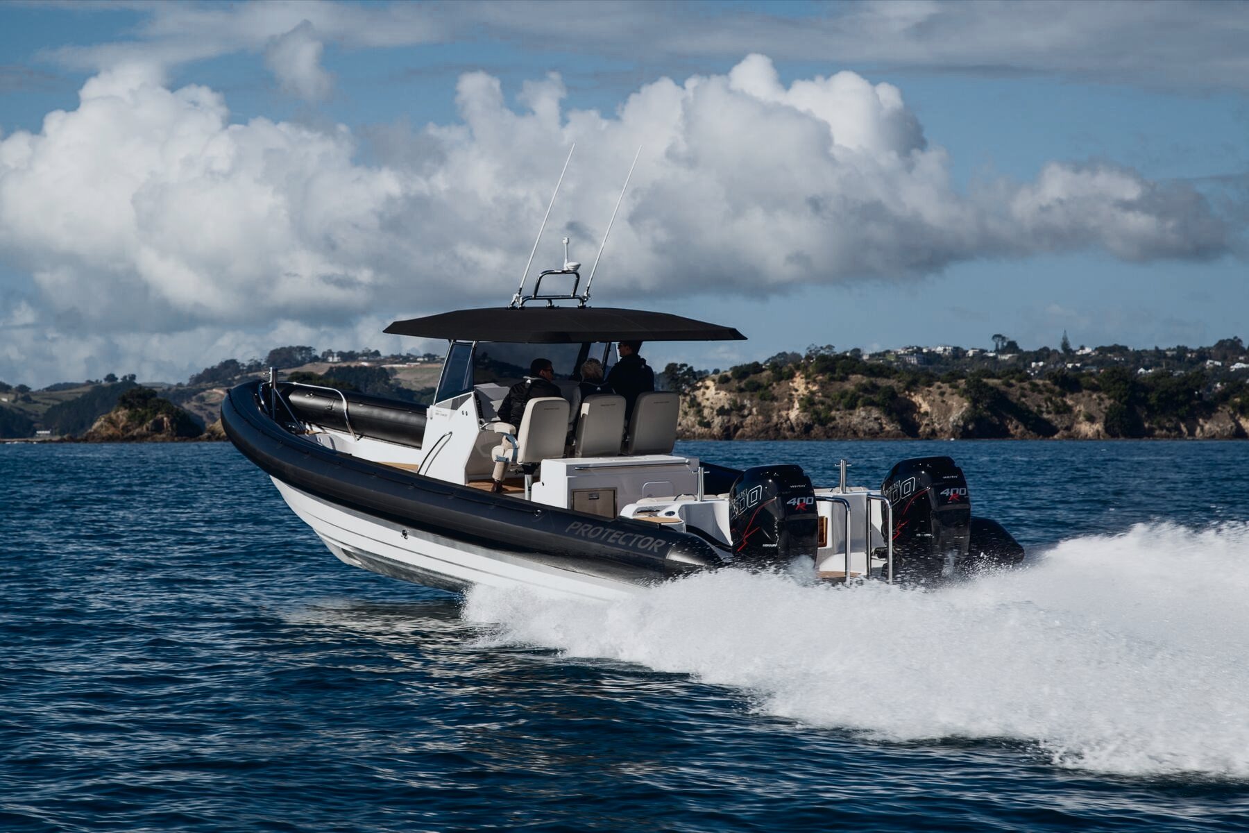 Protector Chase open-console RIB running on open water