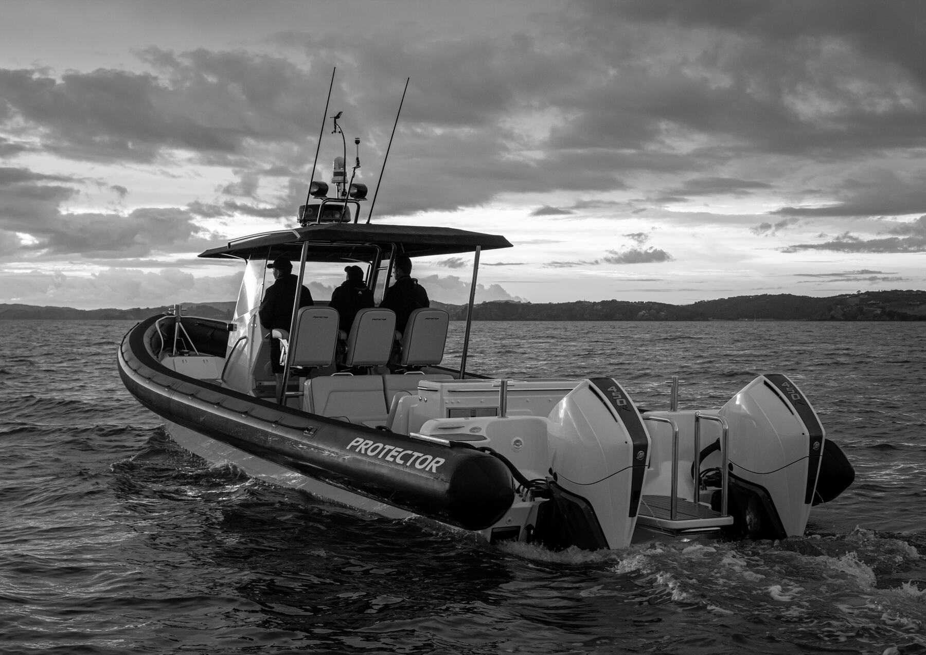 Protector RIB underway in open water, configured for patrol or Coast Guard duty