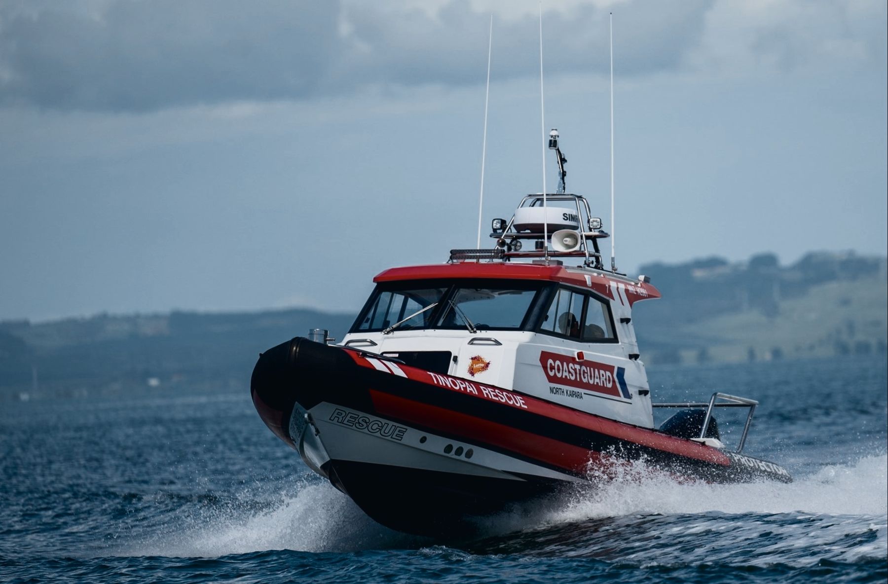 Protector 310 Targa pilothouse RIB running on open water