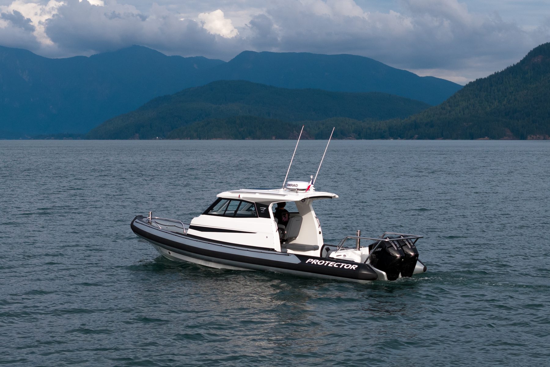 Protector Targa enclosed pilothouse RIB running on open water off the British Columbia coast